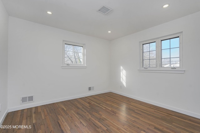 spare room with visible vents and baseboards