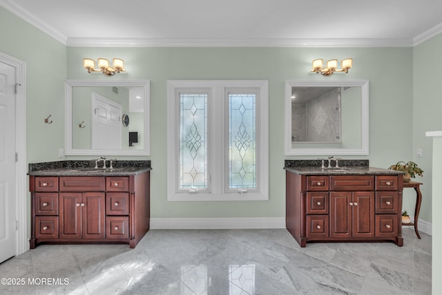 full bathroom featuring marble finish floor, two vanities, a sink, crown molding, and baseboards