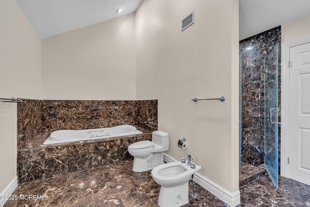 full bathroom featuring a shower stall, baseboards, toilet, a bidet, and a garden tub