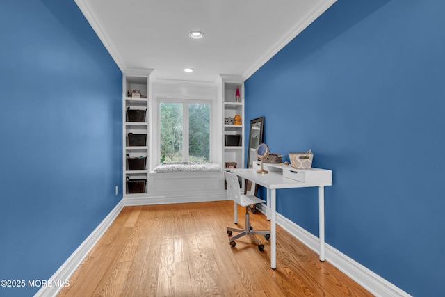 unfurnished office featuring recessed lighting, baseboards, wood finished floors, and ornamental molding