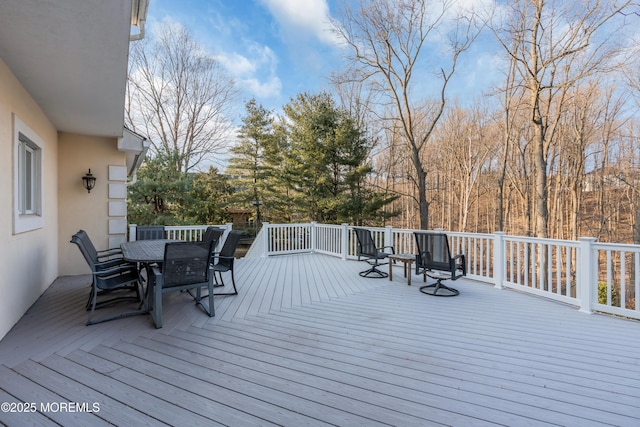 wooden deck with outdoor dining space