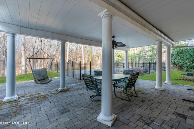 view of patio / terrace with outdoor dining area, a ceiling fan, and fence