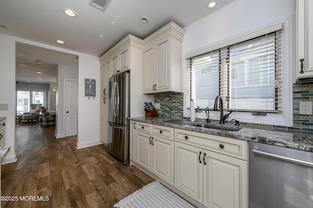 kitchen with visible vents, recessed lighting, dark wood-style flooring, a sink, and appliances with stainless steel finishes