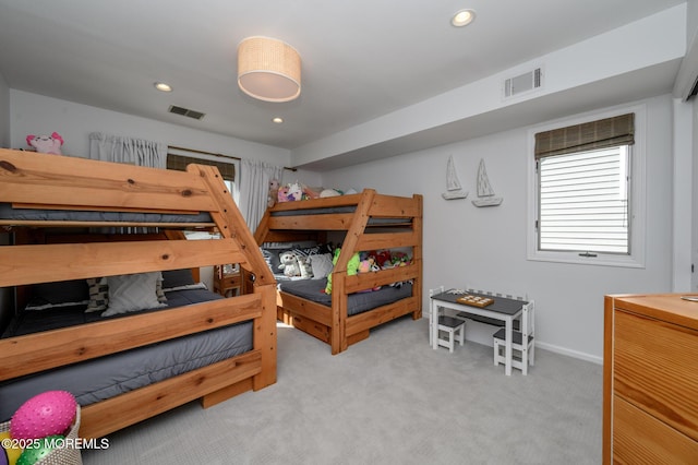 bedroom featuring recessed lighting, visible vents, light carpet, and baseboards