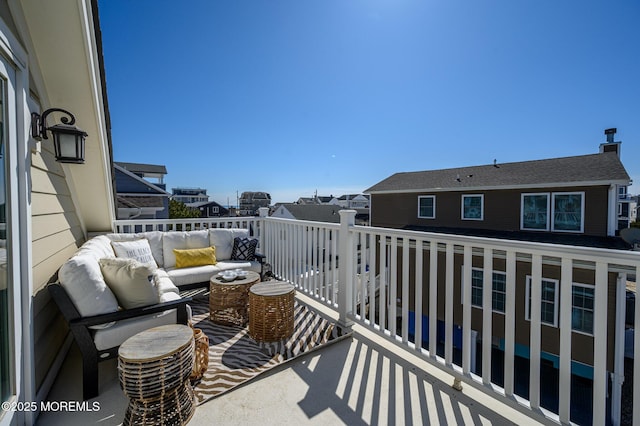 balcony with an outdoor living space and a residential view