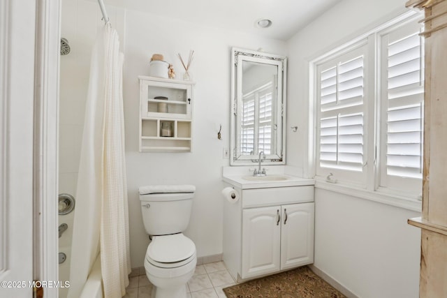 bathroom with toilet, tile patterned flooring, shower / bath combination with curtain, baseboards, and vanity