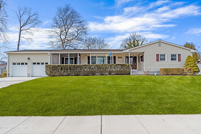 single story home featuring a garage, covered porch, driveway, and a front lawn