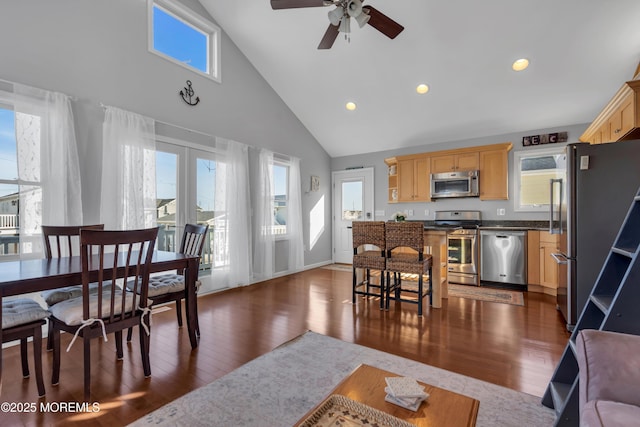 dining room featuring dark wood-style floors, recessed lighting, high vaulted ceiling, and baseboards