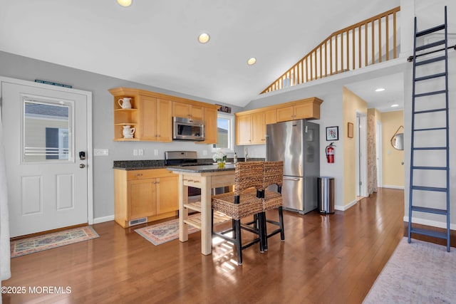 kitchen with stainless steel appliances, dark wood-type flooring, baseboards, and open shelves