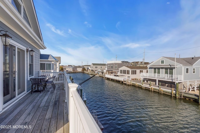 exterior space featuring a residential view and a water view