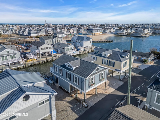 birds eye view of property featuring a residential view and a water view