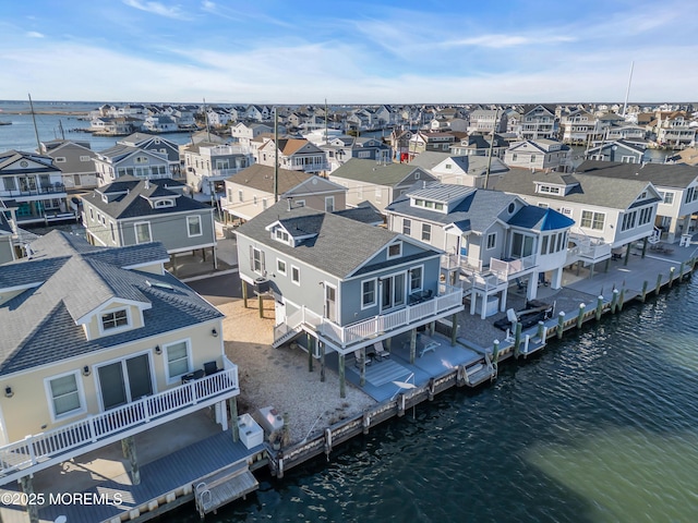 bird's eye view featuring a residential view and a water view