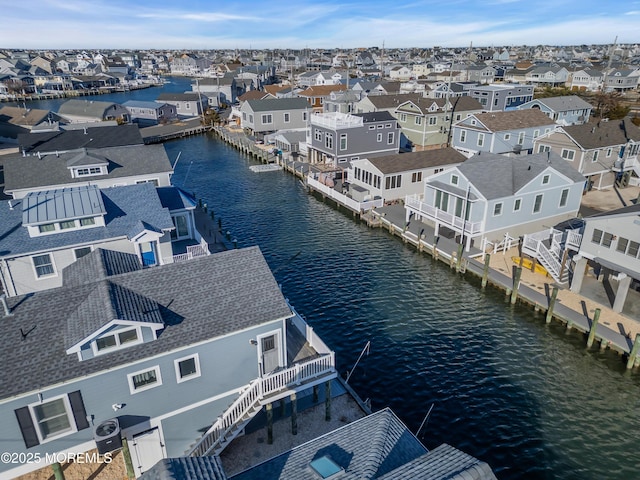 aerial view with a residential view and a water view