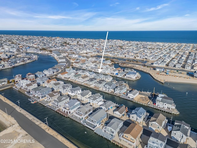 aerial view featuring a residential view and a water view