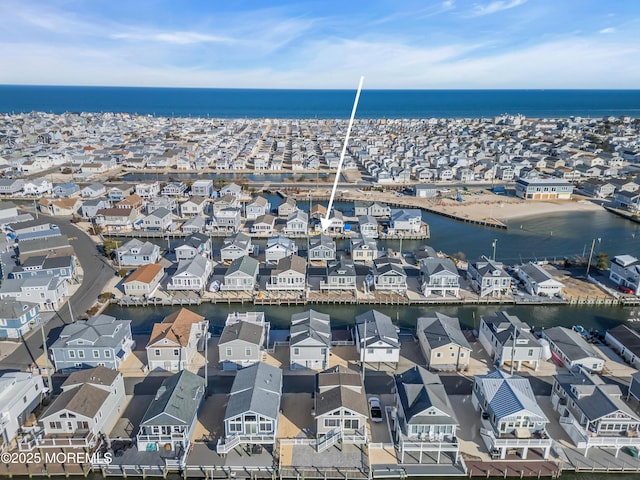 aerial view with a residential view and a water view