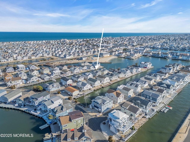 aerial view featuring a residential view and a water view