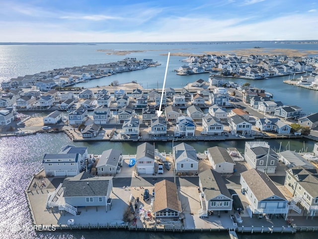 bird's eye view featuring a residential view and a water view