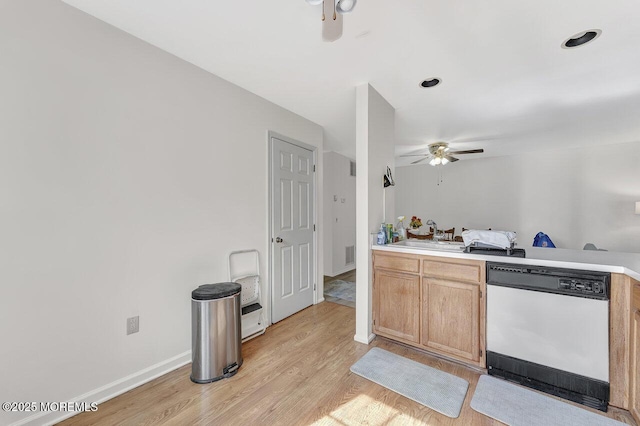 kitchen featuring light wood-style flooring, a sink, ceiling fan, light countertops, and dishwasher