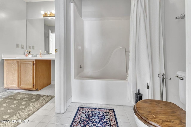 bathroom with tile patterned flooring, vanity, and shower / tub combo