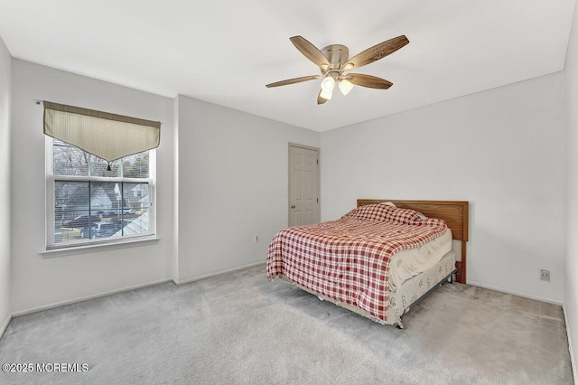 bedroom with carpet and a ceiling fan