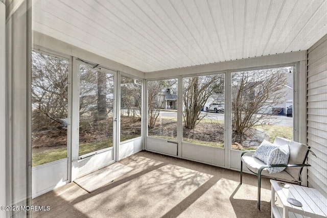 unfurnished sunroom featuring plenty of natural light