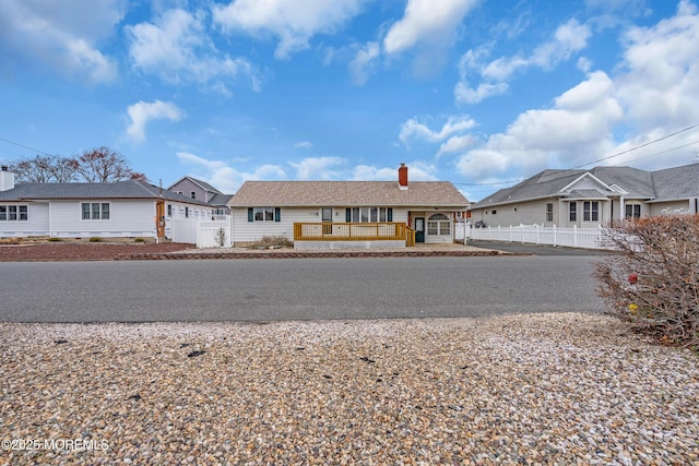 3172 Peddie St, Toms River, NJ 08753 - view of front of house featuring a gate, a chimney, a fenced front yard, a residential view, and covered porch