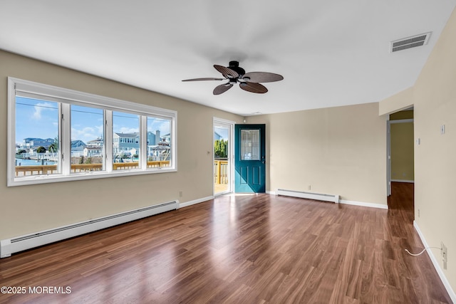 3172 Peddie St, Toms River, NJ 08753 - empty room featuring ceiling fan, visible vents, baseboard heating, and wood finished floors