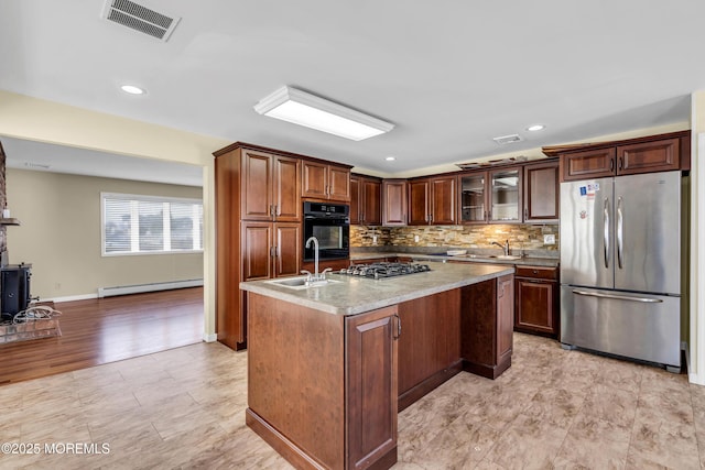 3172 Peddie St, Toms River, NJ 08753 - kitchen featuring a sink, baseboard heating, stainless steel appliances, visible vents, and decorative backsplash