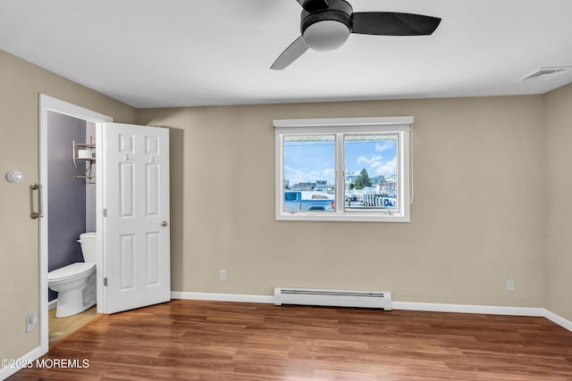 3172 Peddie St, Toms River, NJ 08753 - unfurnished bedroom featuring a baseboard radiator, visible vents, baseboards, and wood finished floors