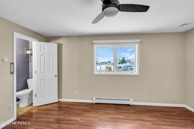 3172 Peddie St, Toms River, NJ 08753 - unfurnished bedroom with baseboards, visible vents, wood finished floors, and a baseboard heating unit
