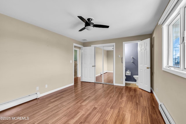 3172 Peddie St, Toms River, NJ 08753 - unfurnished bedroom with a baseboard heating unit, baseboards, light wood-style floors, visible vents, and baseboard heating