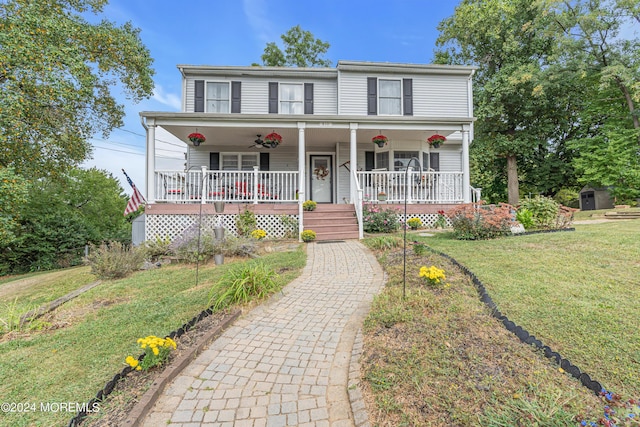 view of front of property featuring a porch and a front lawn