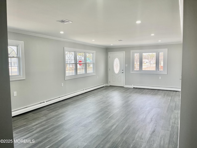 interior space with dark wood-style floors, visible vents, crown molding, and a baseboard radiator