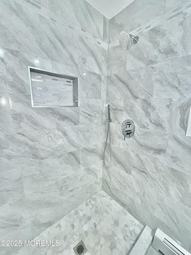 full bathroom with tiled shower