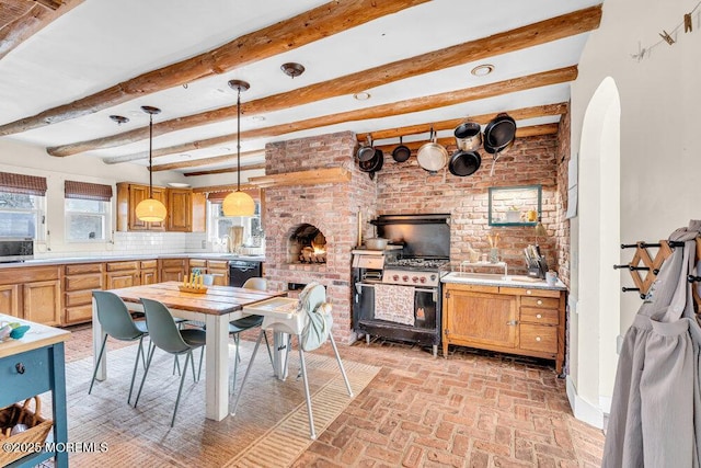 dining area with brick floor, beamed ceiling, and arched walkways