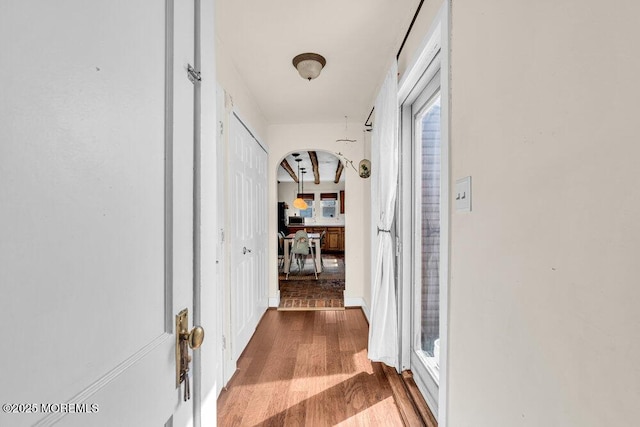 hall with wood finished floors