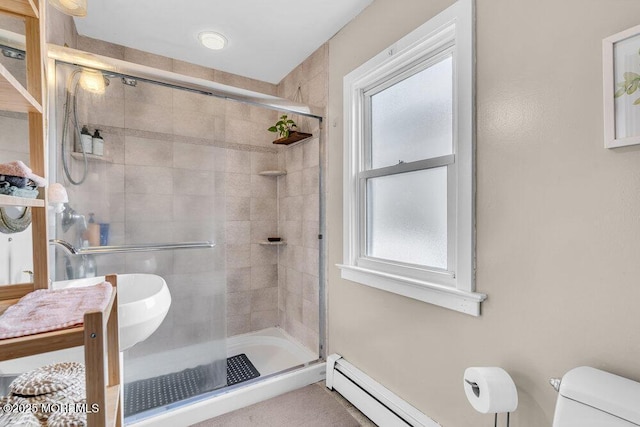 full bathroom featuring a stall shower and toilet