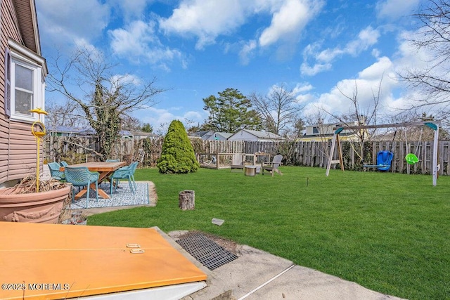 view of yard featuring a patio area and a fenced backyard