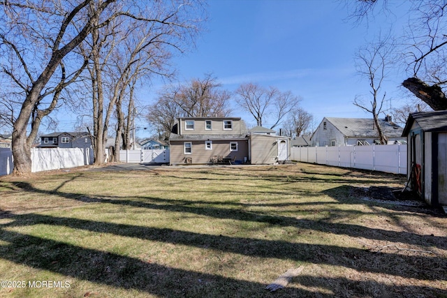 view of yard with a fenced backyard