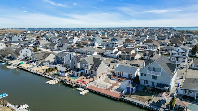 birds eye view of property with a residential view and a water view