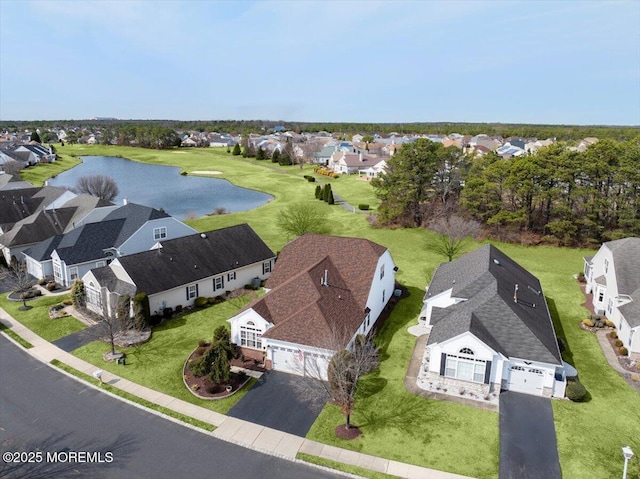 bird's eye view featuring a water view and a residential view