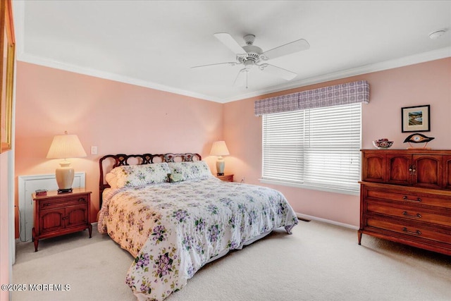 bedroom featuring light carpet, baseboards, crown molding, and ceiling fan