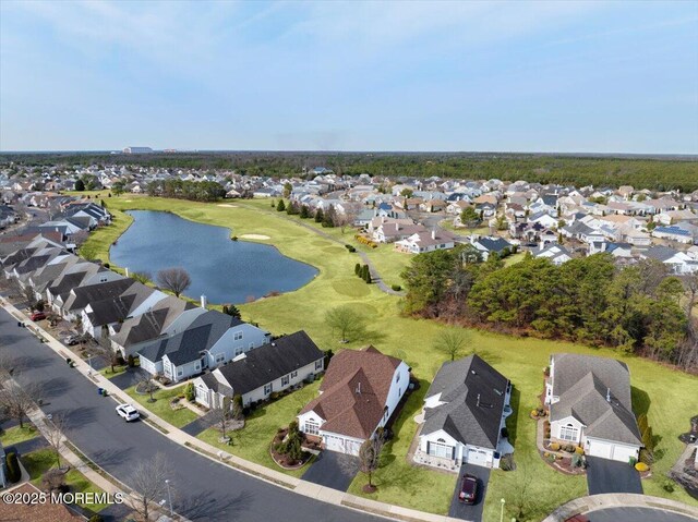 birds eye view of property featuring a residential view and a water view