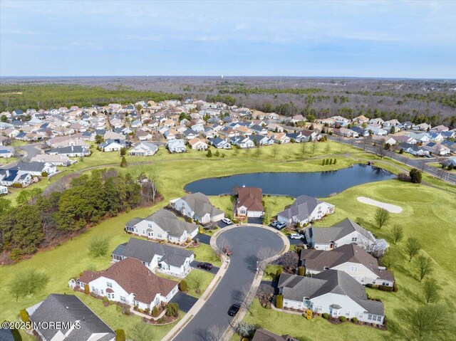 birds eye view of property featuring a residential view and a water view