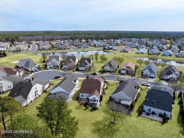 bird's eye view featuring a residential view and a water view