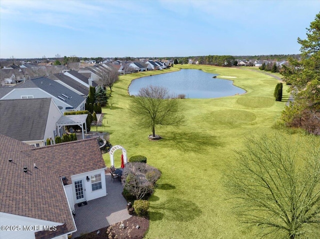 birds eye view of property featuring a residential view and a water view