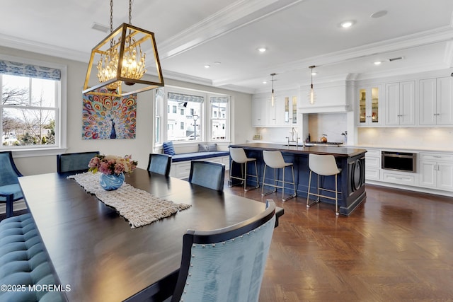 dining space featuring beamed ceiling, recessed lighting, and ornamental molding