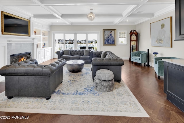 living area featuring beam ceiling, a fireplace, coffered ceiling, and baseboards