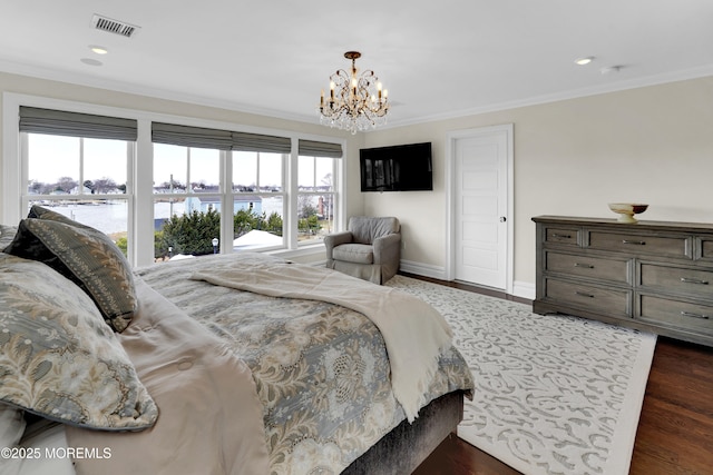 bedroom featuring visible vents, baseboards, dark wood-type flooring, crown molding, and a notable chandelier