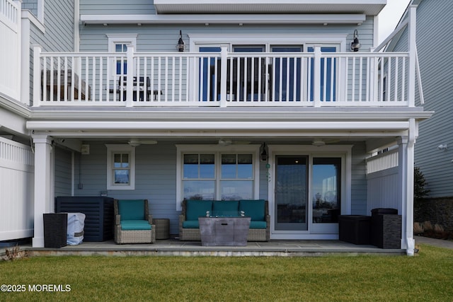 back of property with a patio area and a balcony